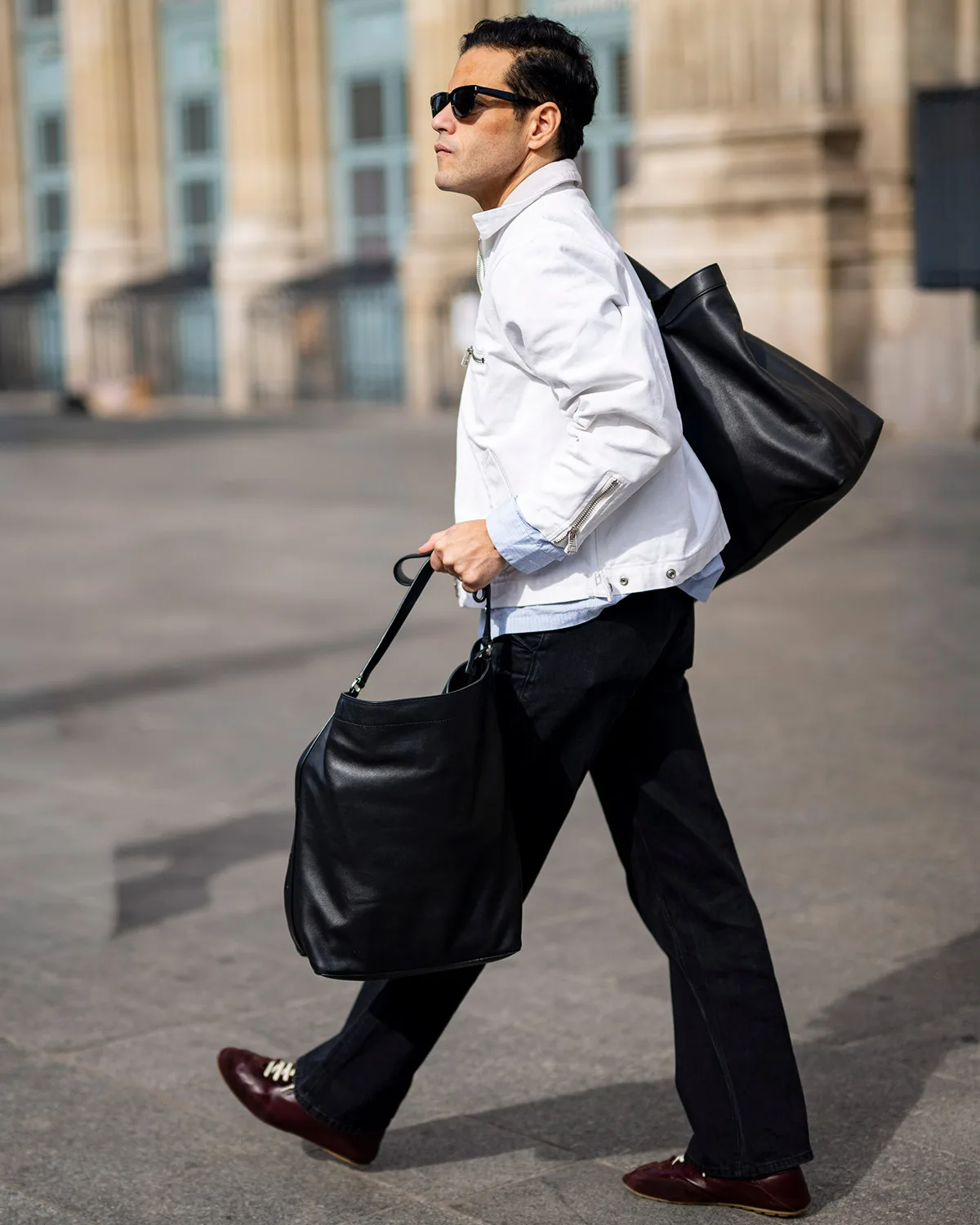 Rami Malek Doubles Up on Bags in Paris