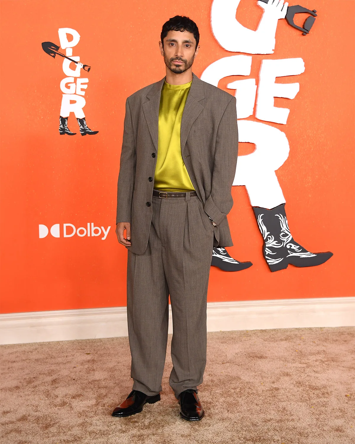 Riz Ahmed Brightens Brown Tailoring With Chartreuse Satin