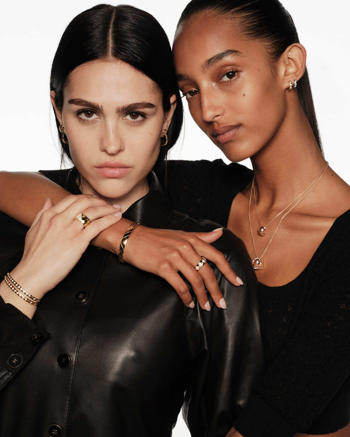Amelia Gray wears a COCO CRUSH ring, earrings and bracelets, as well as COCO hoop earrings, quilted motif, in 18K BEIGE GOLD and yellow gold, diamonds. Mona Tougaard, wears a COCO CRUSH ring and single earrings, as well as a COCO necklaces, quilted motif, in 18K BEIGE GOLD and white gold, diamonds.